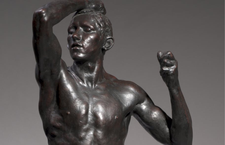 Bronze sculpture of a man with his arm raised, his hand behind his head