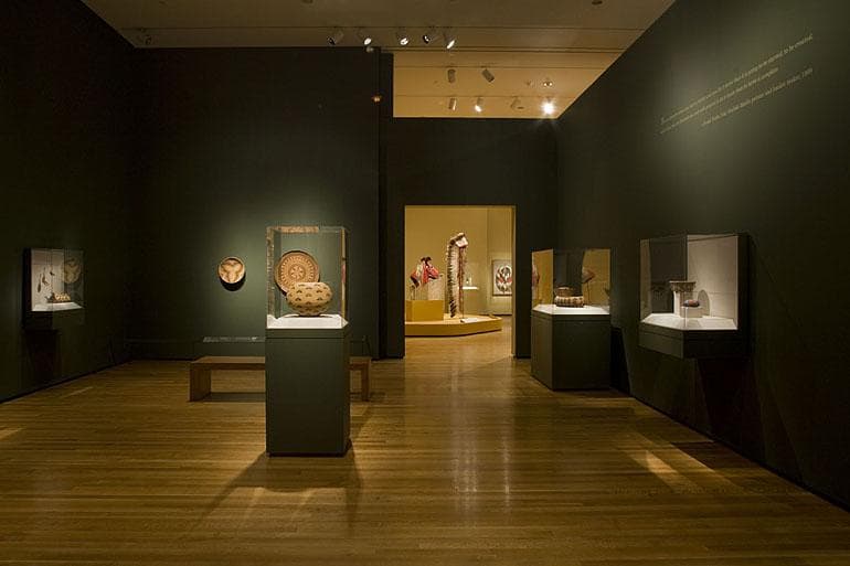 A dark gallery with dramatic lighting