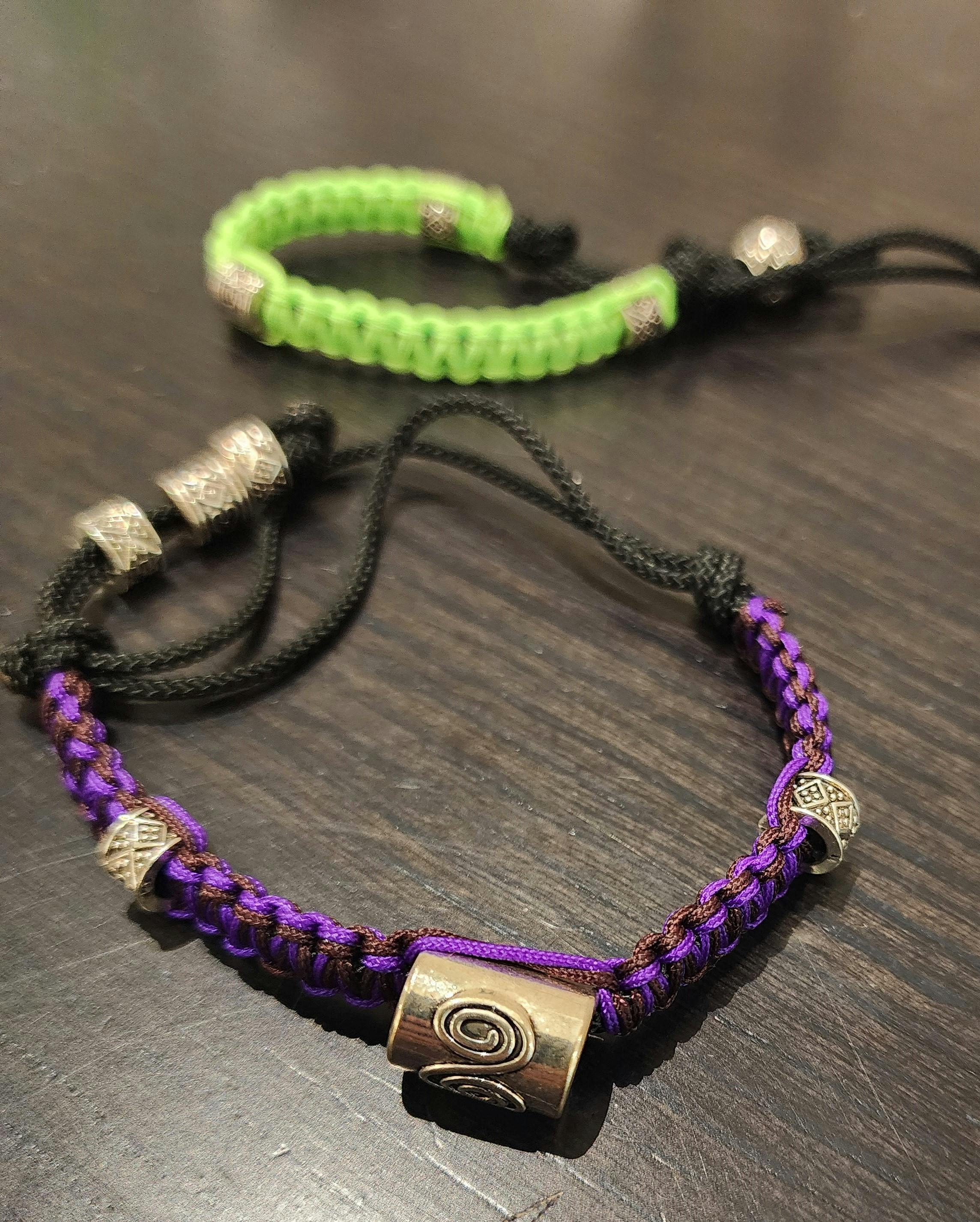 Bracelets made of nylon and paracord with metal beads.