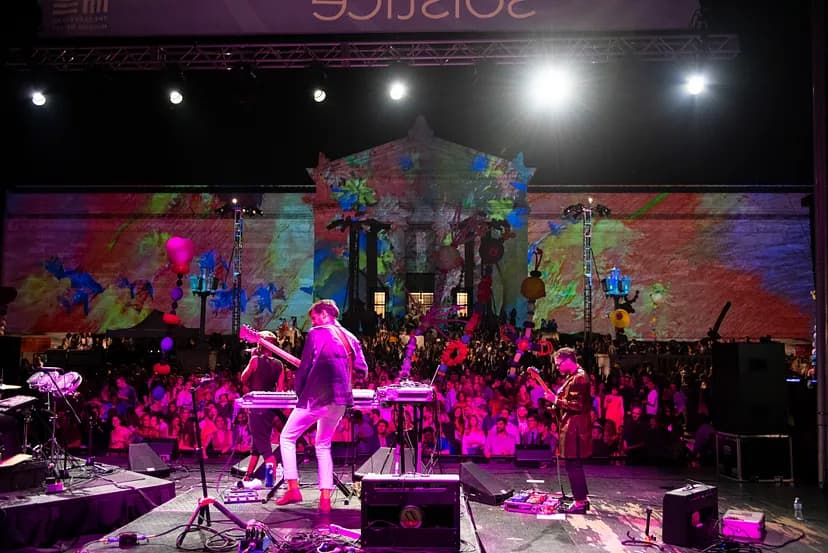 Band playing in front of a large crowd.