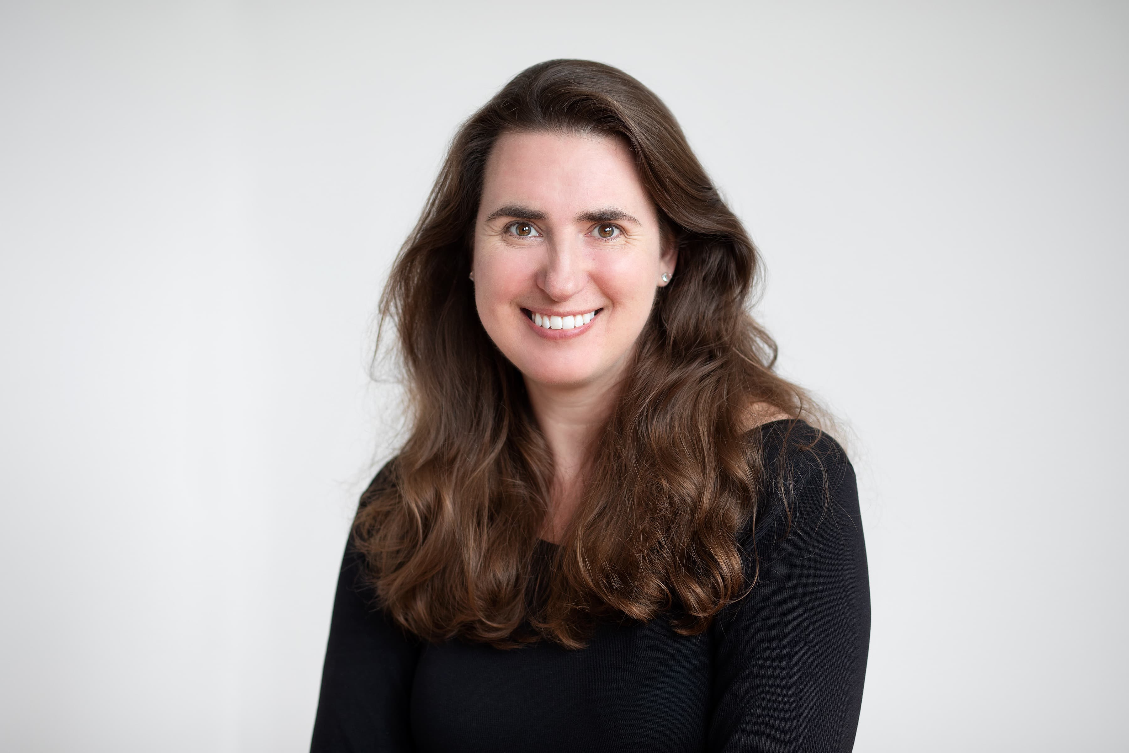 Headshot of a woman with a plain white background