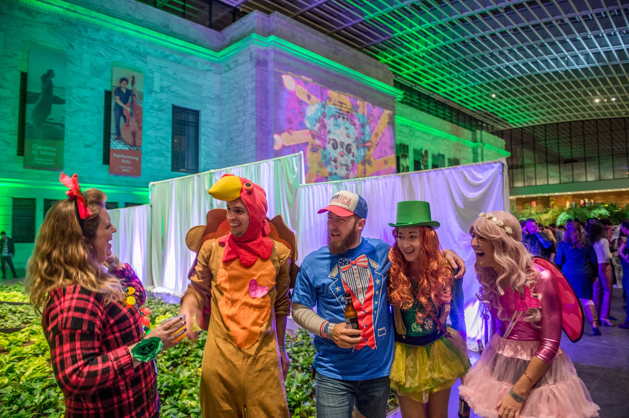 People enjoying a MIX event in the atrium dressed in costumes
