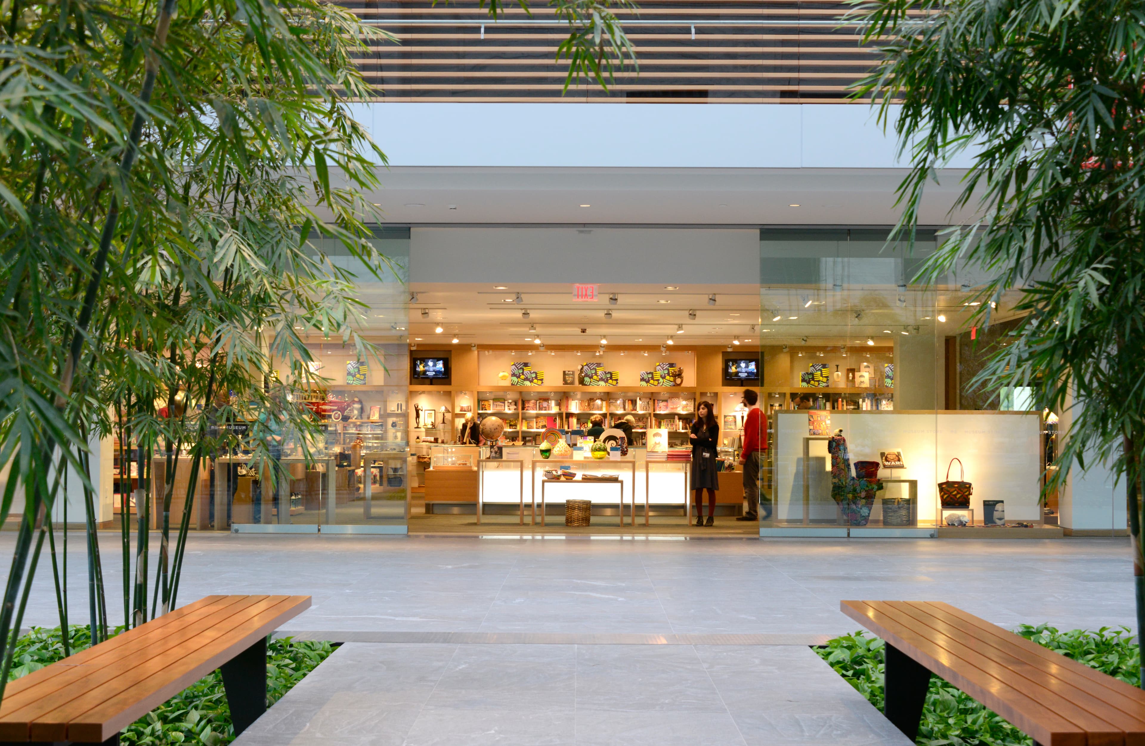 View of the museum store with trees on either sides of the door