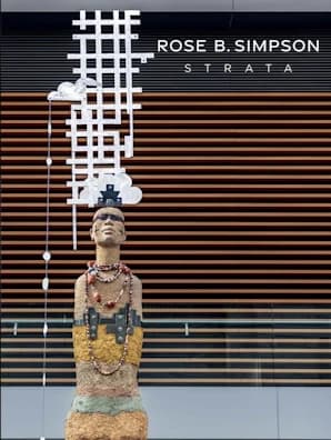 A book cover of a statue adorned with a tall white hashed-line headpiece. "Rose B. Simpson Strata" is written in the top right corner.