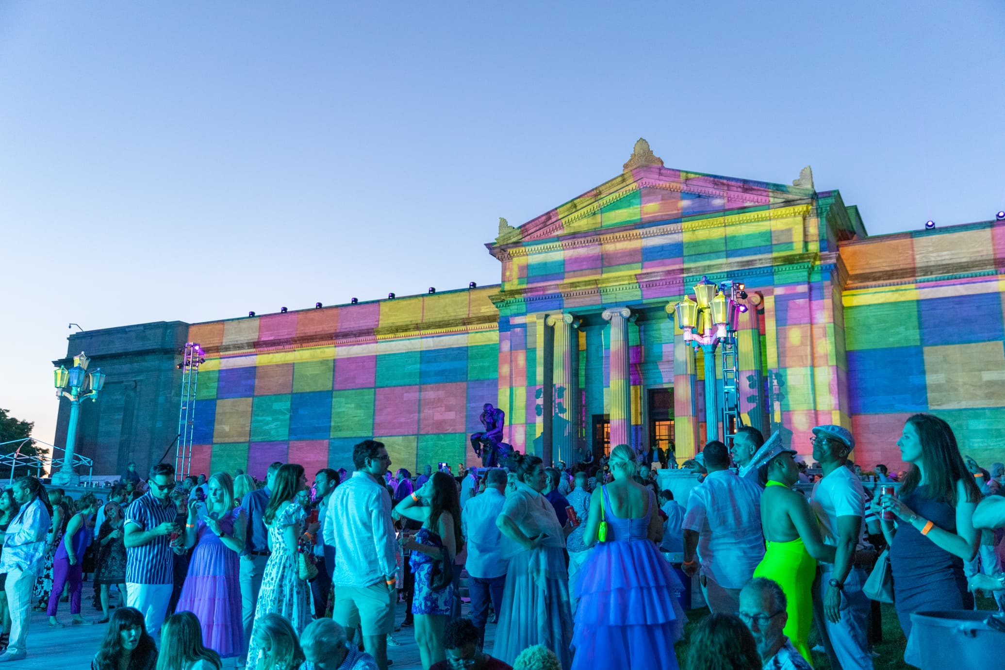 young people enjoying music in front of the 1916 building