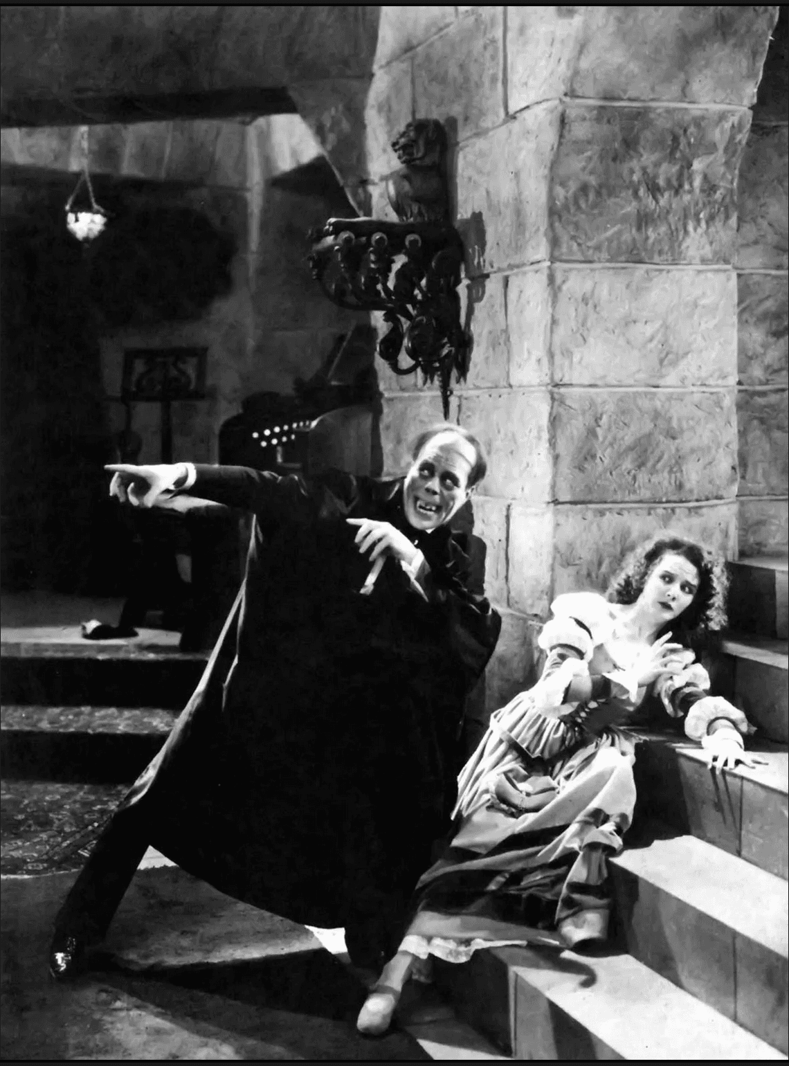 Black and white image of two figures on a staircase