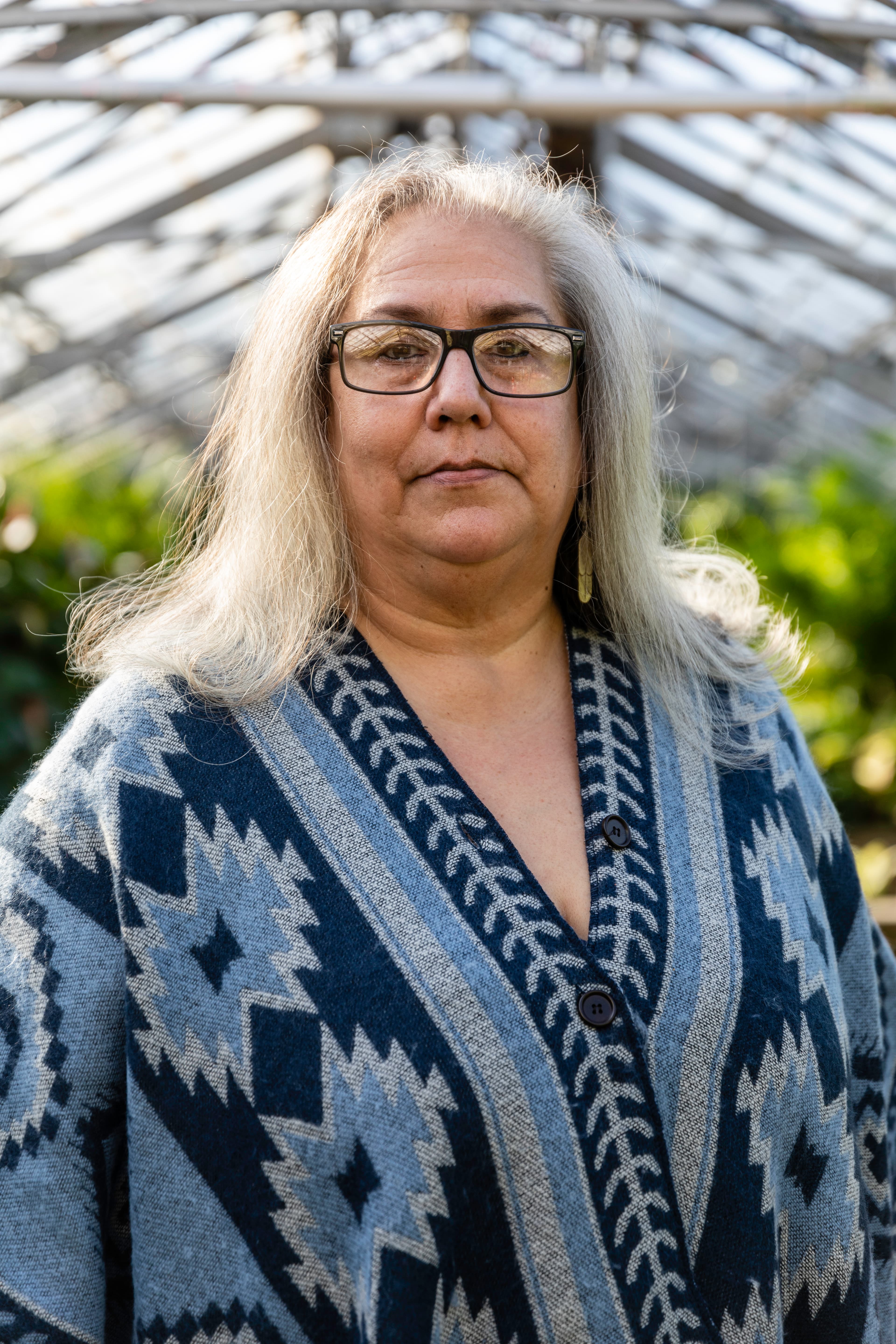 Portrait of a woman in a blue patterned blouse