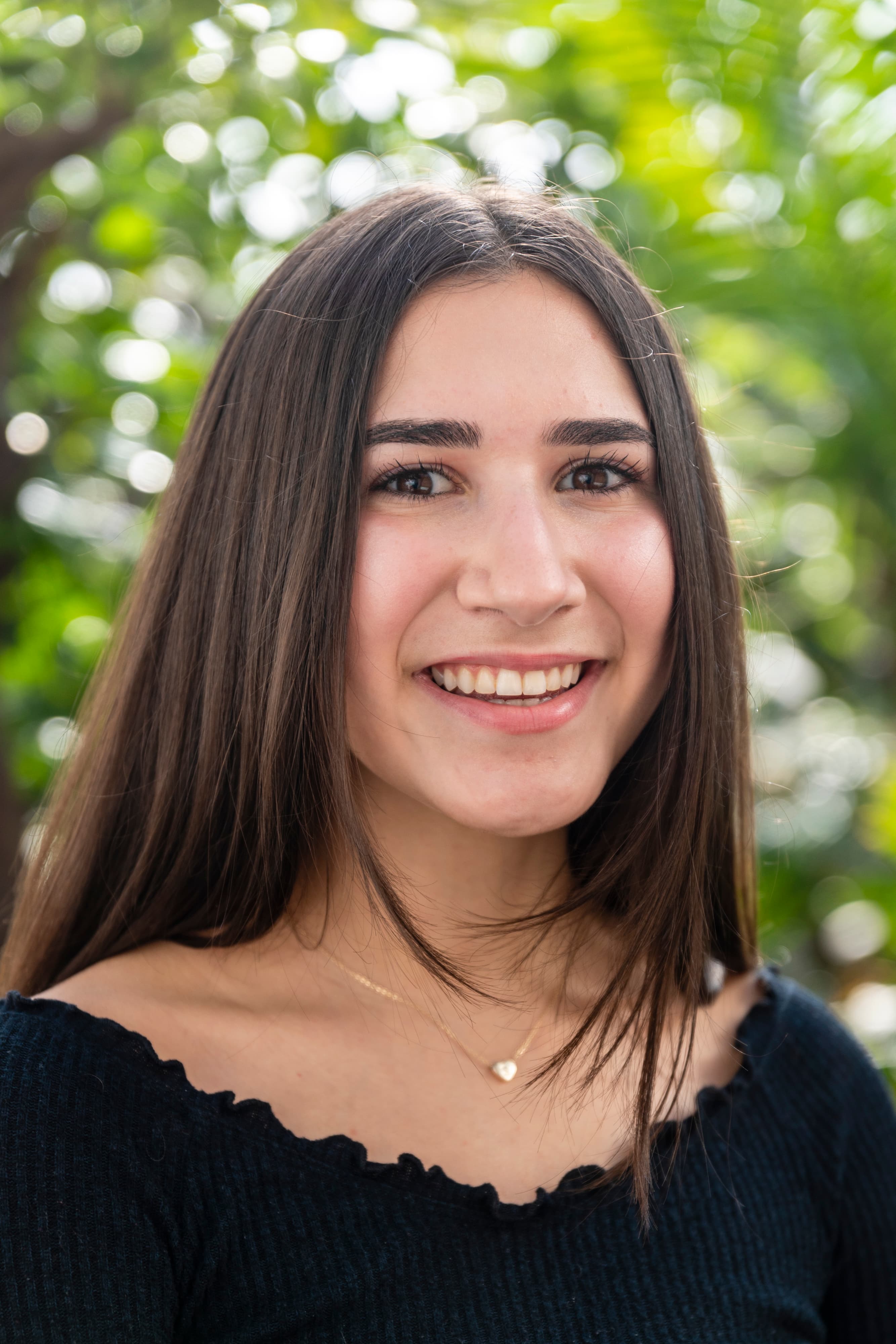 Headshot of a girl with long brown hair
