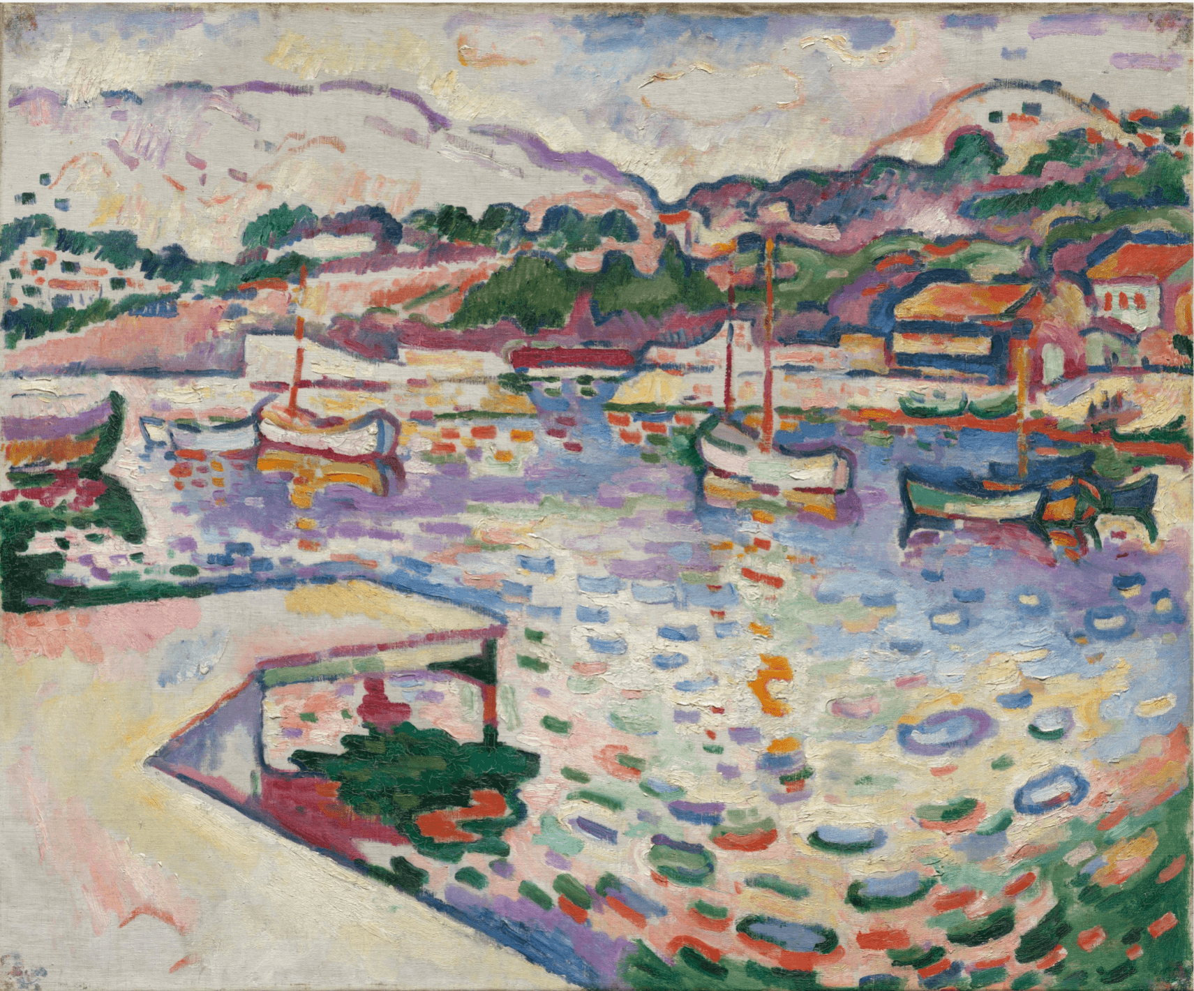 A horizontally oriented oil painting made of thick, rhythmic dabs of paint depicts a vibrant harbor. In the lower left, a triangular white pier points toward shimmering water filled with mosaic-like patches of blue, purple, and green. Several small boats with orange masts float in the center. In the background, rolling pink and white hills rise above orange-roofed houses on the right under a pale, dappled sky.
