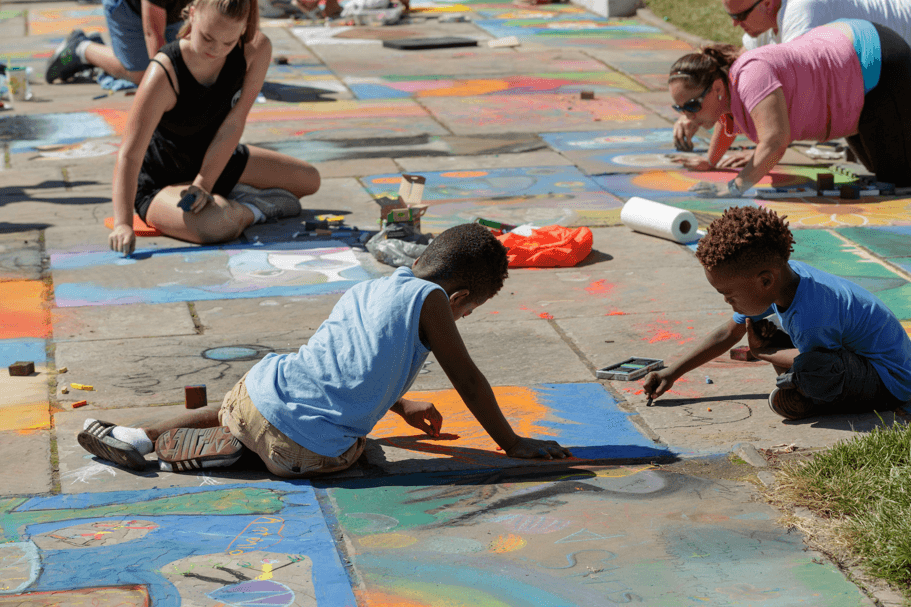 Children drawing with chalk during the CMA's Chalk Festival