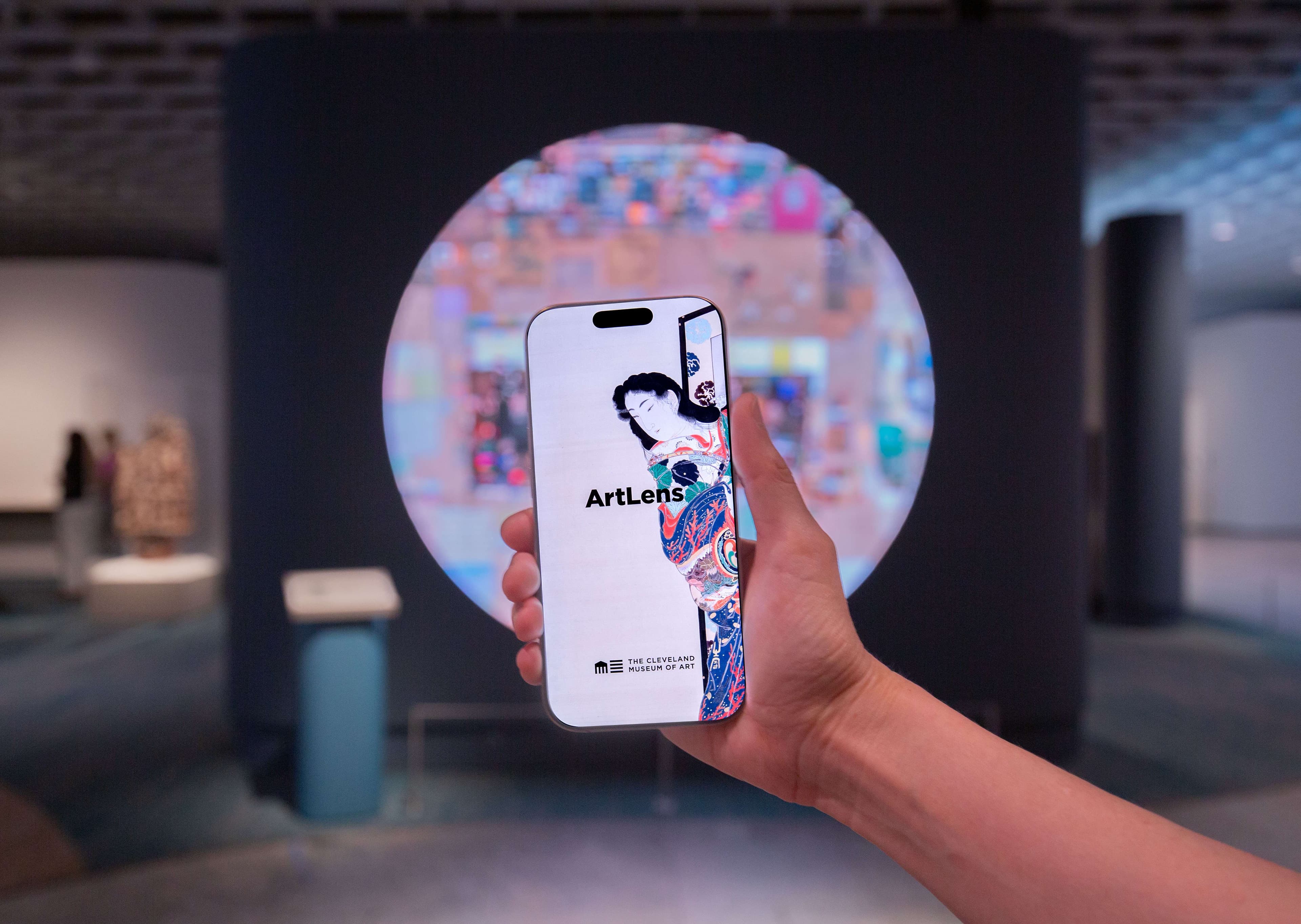 The ArtLens App loading screen being held up in ArtLens Gallery