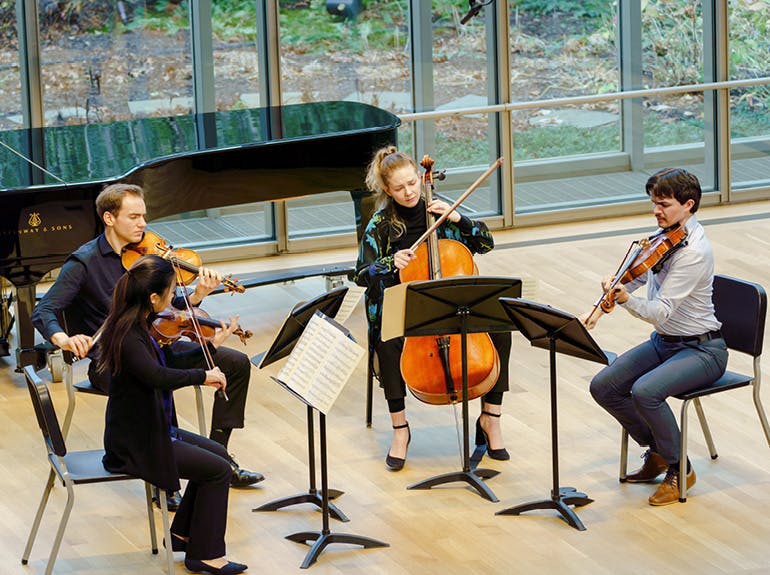 Classical students performing on stage