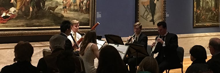 Students performing in gallery