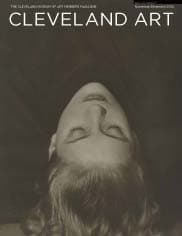 Black and white photo of lady's face upside down, eyes closed, on magazine cover